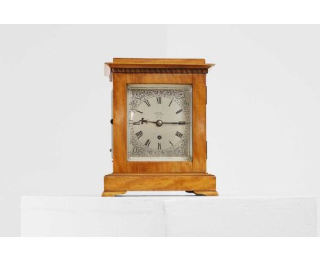 A satinwood library clock,  19th century, by Connell, London, numbered '970', the silvered rectangular dial with Roman numera