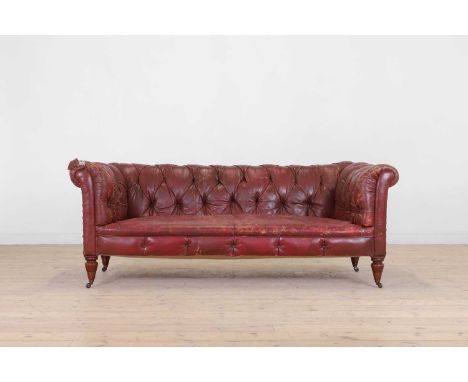 A late Victorian chesterfield sofa,  c.1890, with buttoned Moroccan leather upholstery, raised on ring-turned supports and li