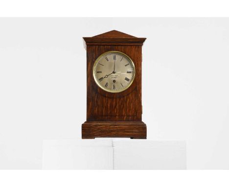 A Regency oak-cased mantel clock, by Vulliamy, London, the silvered and inscribed dial enclosing a single fusee movement, bac