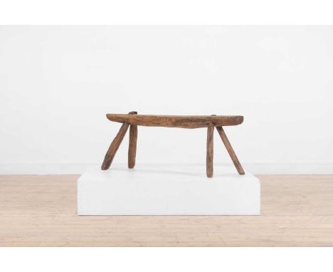 A vernacular elm pig bench, late 18th/early 19th century, of joined construction, 104cm wide20cm deep42cm highProvenance: Yor