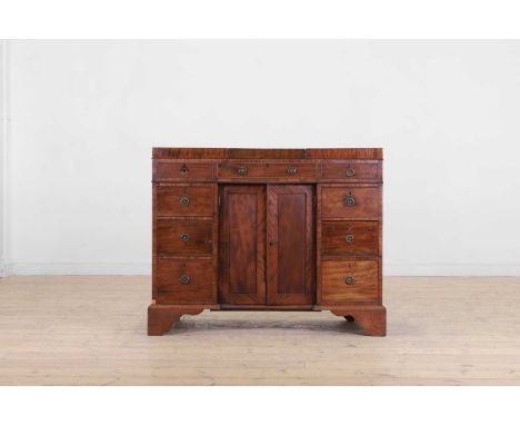 A Regency mahogany dressing chest, early 19th century, the fold-out top enclosing various compartments, stamped 'PRATT &amp; 