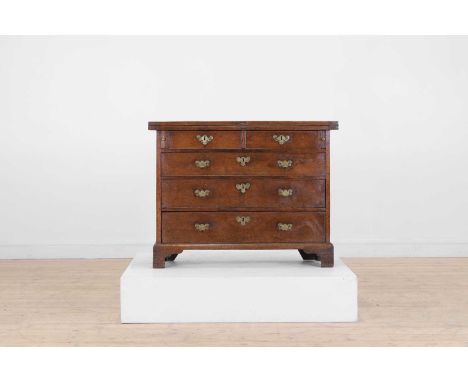 A small George II oak bachelor's chest, mid-18th century, the folding top over two short drawers, over three long drawers, an