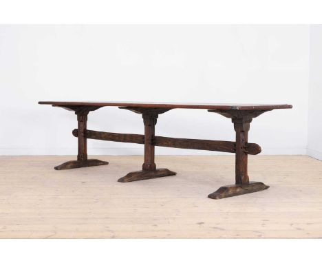 A long pine refectory table, 20th century, but incorporating 17th century elements, the rectangular top above three chamfered