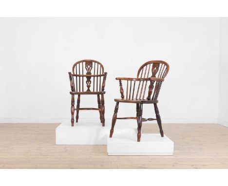 A matched set of six yew and elm low hoop-back Windsor armchairs, mid-late 19th century, North East Midlands, each with a pie