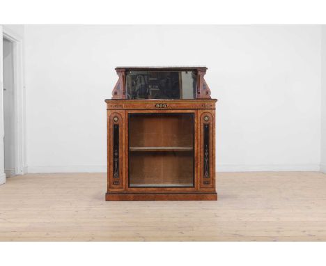 A Victorian Aesthetic Period walnut and ebonised pier cabinet, late 19th century, the high mirrored back over an inlaid and g