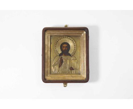 An icon of Christ Pantocrator,  late 19th century, Russian, in a gilt-metal oklad,  21cm wide 16.5cm high, framed 25.5cm wide