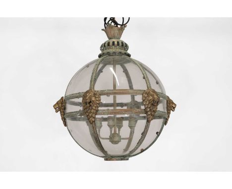 A large Regency-style patinated and gilt-brass globe lantern, of recent manufacture, with an acanthus cast finial, over a sca