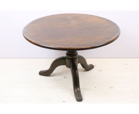 20th century oak circular occasional table of low form, on turned support and tripod base, 47cm high x 73cm diameter