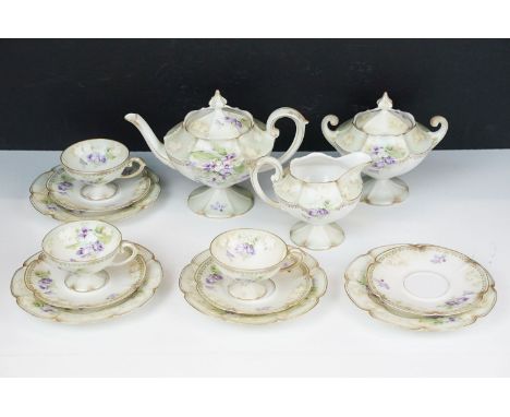 R.S Poland China tea service set with lilac flowers and gilt detail comprising of three cups, four saucers, four side plates,