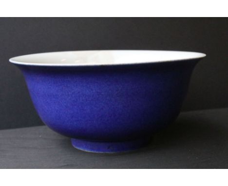 Chinese Kangxi footed bowl having a flared rim, powder blue exterior with an underglaze hand painted deity to inner base. Pai