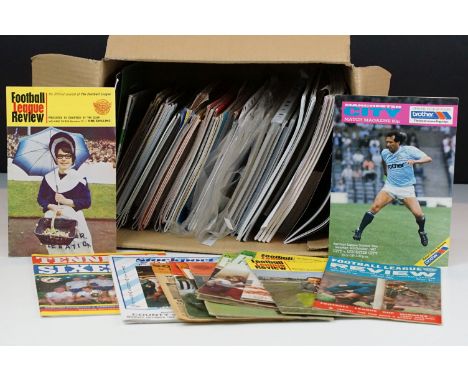 A collection of football programmes to include Manchester United, Reading, Southampton, Celtic ...etc.. together with some in