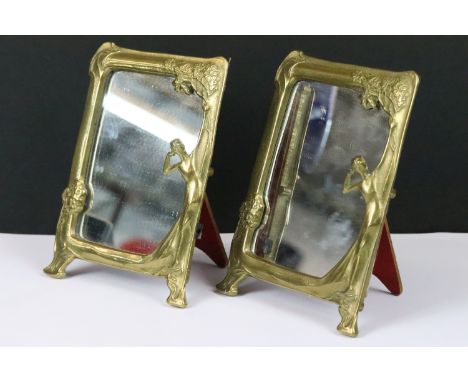 A pair of early to mid 20th century Art Nouveau brass easel back table top mirrors. 
