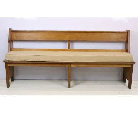 Robert 'Mouseman' Thompson, oak bench / church pew, with pocket for hymn books and padded seat cushion, with carved mouse sig