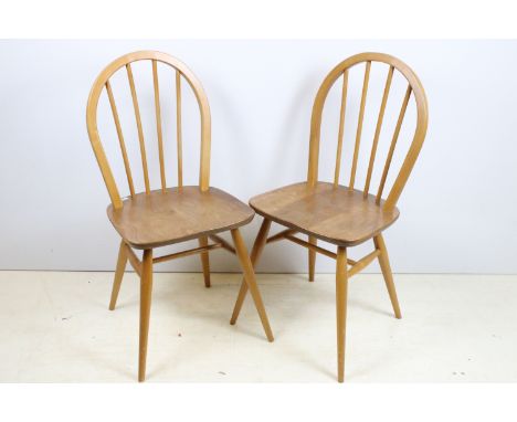 Pair of Ercol chairs, model 400, beech and elm stick, one with partial label, 85cm high x 39.5cm wide x 38cm deep