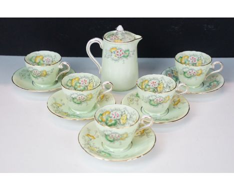 Set of five Aynsley Dianthus on light green and gilt edge coffee cups and saucers together with lidded pot jug, H 13cm