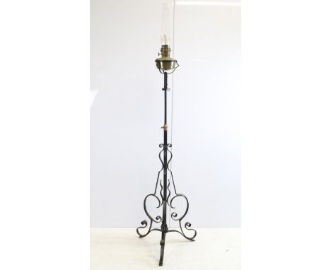 Tall wrought iron and brass oil lamp floor light with glass chimney, H 190cm