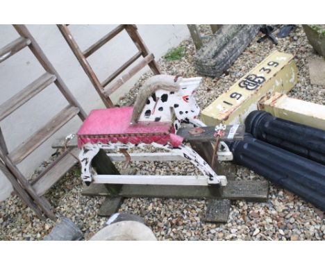 Vintage wooden framed rocking horse. Measures 100cm wide. 