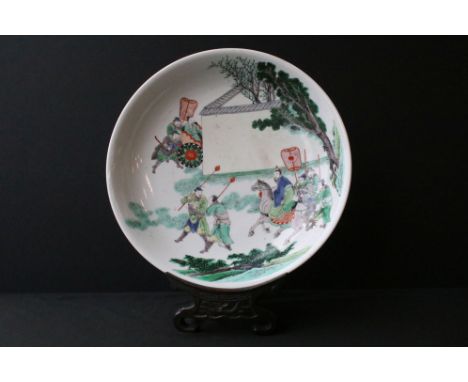 Chinese Kangxi famille verte dish featuring an over glaze hand enamelled scene depicting figures in a walled garden. Double f