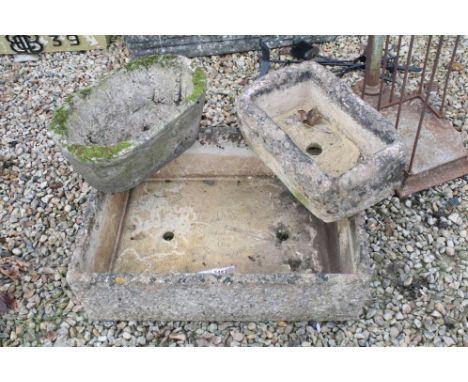 Cotswold Stone 'Man Hole Cover' U14 reconstitutes tone planter of rectangular form together with two smaller examples. Larges