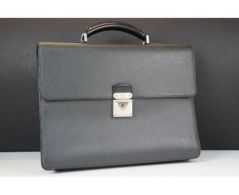 Louis Vuitton black leather Robusto briefcase, flap closure with latch, handle to top, lined in canvas, three internal compar