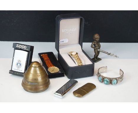 A group of mixed collectables to include a Zippo lighter, World war One artillery fuse, pocket lighters, watches, bottle open