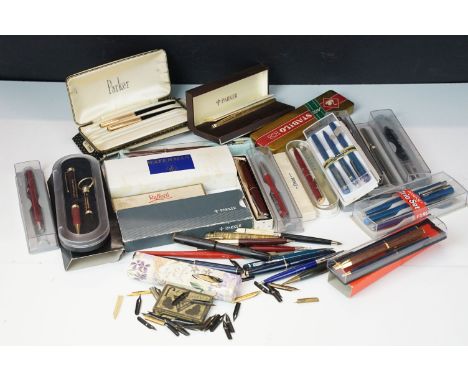 A large collection of vintage pens and propelling pencils to include Parker, Conway Stewart and Waterman examples, mostly wit