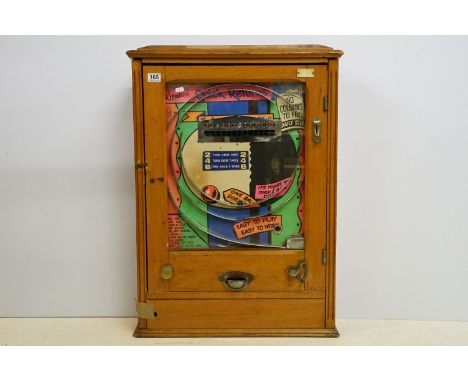 Wonder's 'Quick Returns' one ball release penny slot machine, coin entry, hinged wooden case, H 89cm, W 63cm, D 19cm