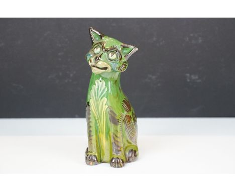 C H Brannam green glazed pottery model of smiling cat, signed to base, H 17.5cm