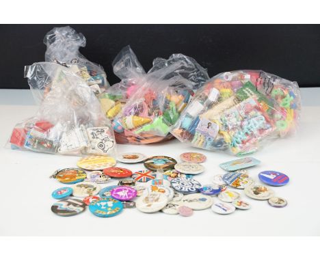 A collection of 1980's shaped and scented erasers / pencil rubbers together with a selection of button badges. 