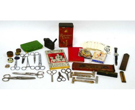 Baby Dolls, playing cards, one other pack of Erotic playing cards, scissors, Rowntree's Cocoa tin, Timex "Hop Along Cassidy" 