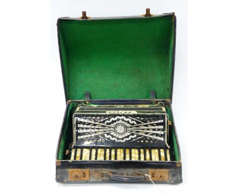 A Delfine Piano Accordion with 48 keys, labelled Walker F Furnsee, Southampton, with a grey and cream marbled case