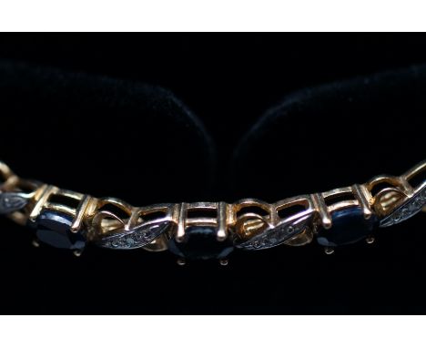 9ct Gold bracelet set with sapphire &amp; diamonds 