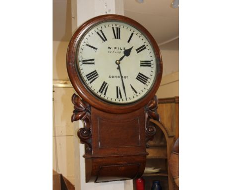 A mahogany drop dial circular wall clock, the 16 inch dial with Roman numerals and signed 'W. Pile 64 Frith St Soho Sq', the 