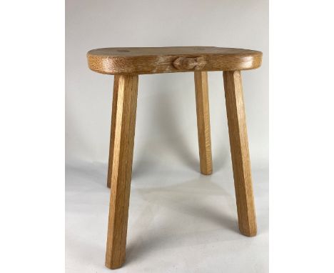 A Robert Mouseman Thompson oak stool shaped top with carved mouse signature, on four faceted sloping legs, 37cm