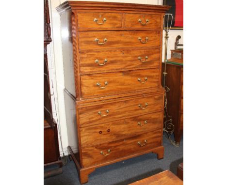 A George III mahogany tallboy chest on chest, with architectural cornice, two short over three long drawers, above brushing s