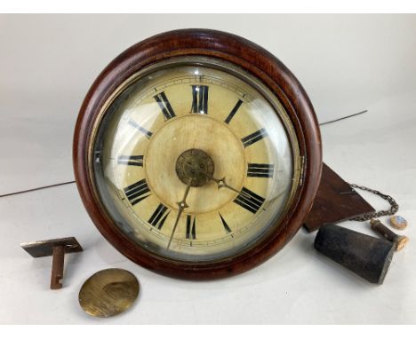 A late 19th century Black Forest circular wall clock with 22cm circular dial, movement striking on a bell, weight and pendulu