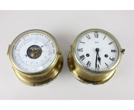 A German brass cased bulkhead style clock and aneroid barometer by Schatz, each with 5 inch dial