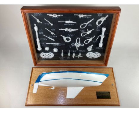A half model boat on wooden mount, with brass plaque 'Clambake, Oyster 26 - No 21, Designed Holman &amp; Pye, 24cm by 55cm, t
