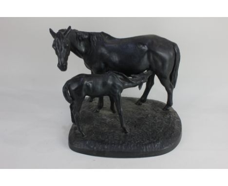 A Russian Kasli cast iron model of a mare and suckling foal standing on a plinth base, indistinctly signed, marks to base, 35