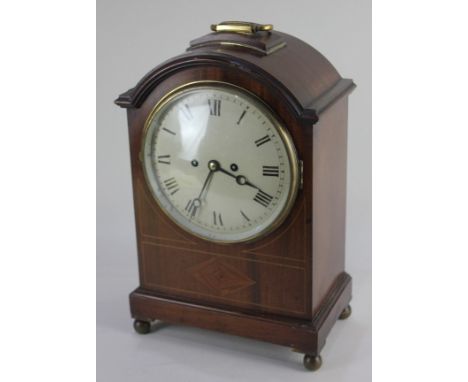 A late 19th / early 20th century inlaid mahogany mantle clock with 19cm circular dial, movement striking on a gong in dome ca