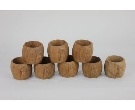 A set of eight Robert Thompson Mouseman serviette rings octagonal form with carved signature mouse, 5cm