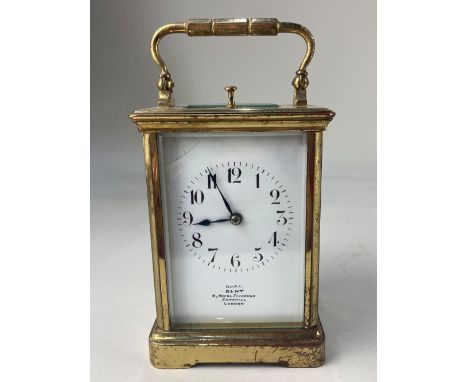 A gilt brass and bevelled glass cased repeater carriage clock, the white enamel dial with Arabic numerals (a/f), marked Dent,