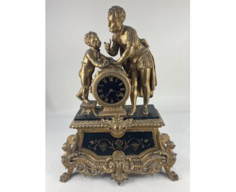 A 19th century gilt figural mantle clock, the circular black and gilt face, marked Philippe, the movement stamped Philippe Ro