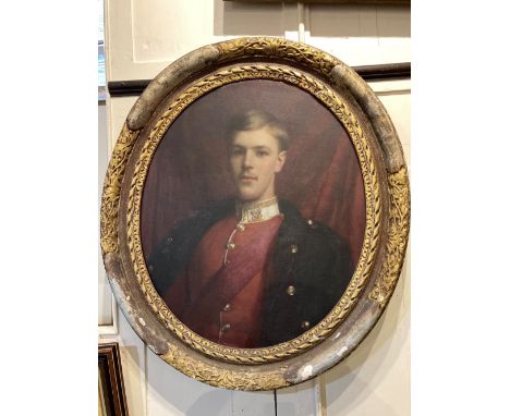 19th century school, portrait of a young army officer with blonde hair, oil on canvas, unsigned, in gilt oval frame, 74cm by 