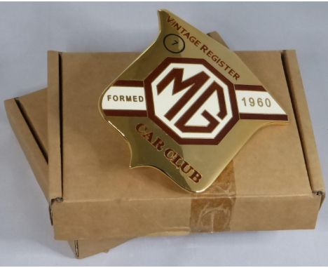 MG GILT CAR BADGES. A pair of MG Vintage Register motor car badges numbered 4 and 7, being two of fifty badges manufactured i