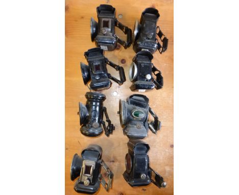 EIGHT OIL-POWERED BICYCLE LAMPS,  to include a rare Lucas Black Prince, front and rear lamps. (8) 
