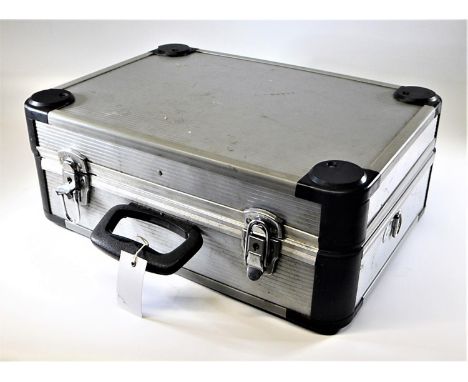 AN ENGINEER'S TOOL CASE.  An aluminium case with carrying handle, opening to reveal partitioned areas containing assorted han