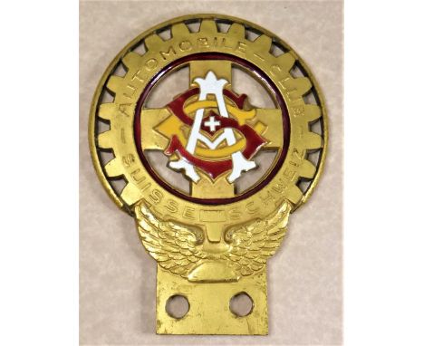 SUISSE AUTOMOBILE CLIB.  A rare and interesting 1930s badge of the club founded in 1898, enamelled typographical weave of the