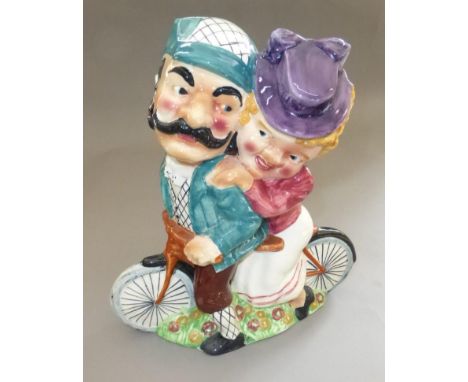 SHORTER &amp; SONS 'DAISY BELL'.  A multi-coloured underglaze flower vase portraying two riders on a tandem bicycle. The larg