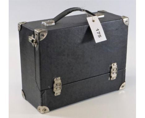 AN ENGINEER'S TOOL BOX.  A small black Rexine-covered box with carrying handle, opening to reveal three drawers and assorted 